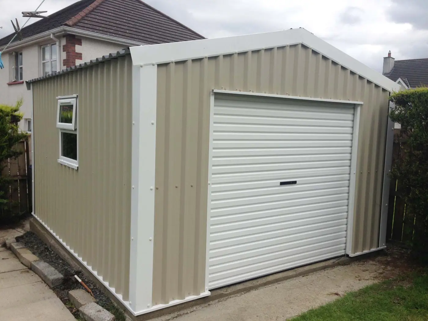 Cream and white back garden garage